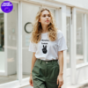 a girl in a white t-shirt with the print two minutes turkish made by the asocial chameleon
