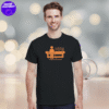 a man wearing a black t-shirt with an orange print made by the asocial chameleon
